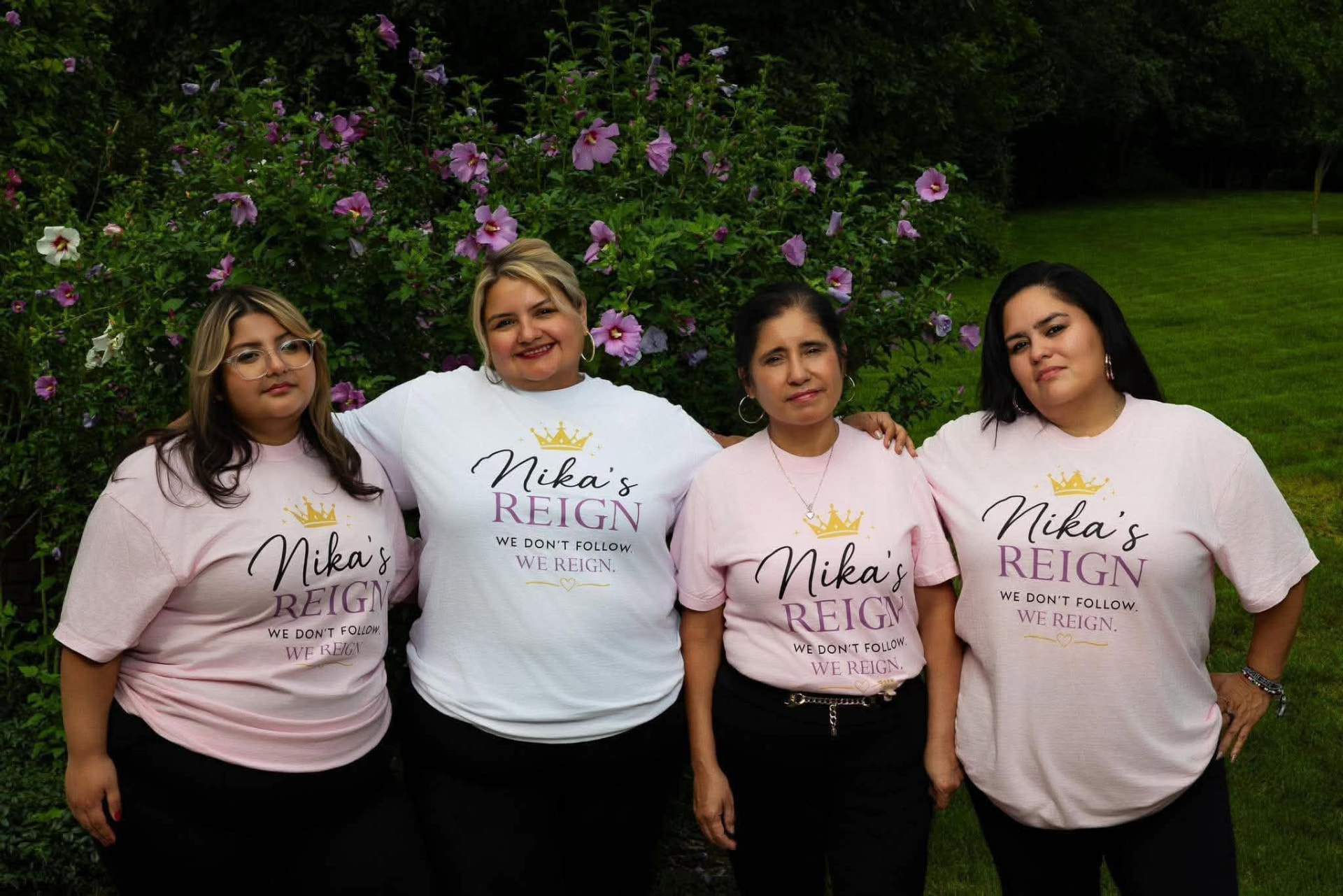 Women of Nika's Reign together in a garden