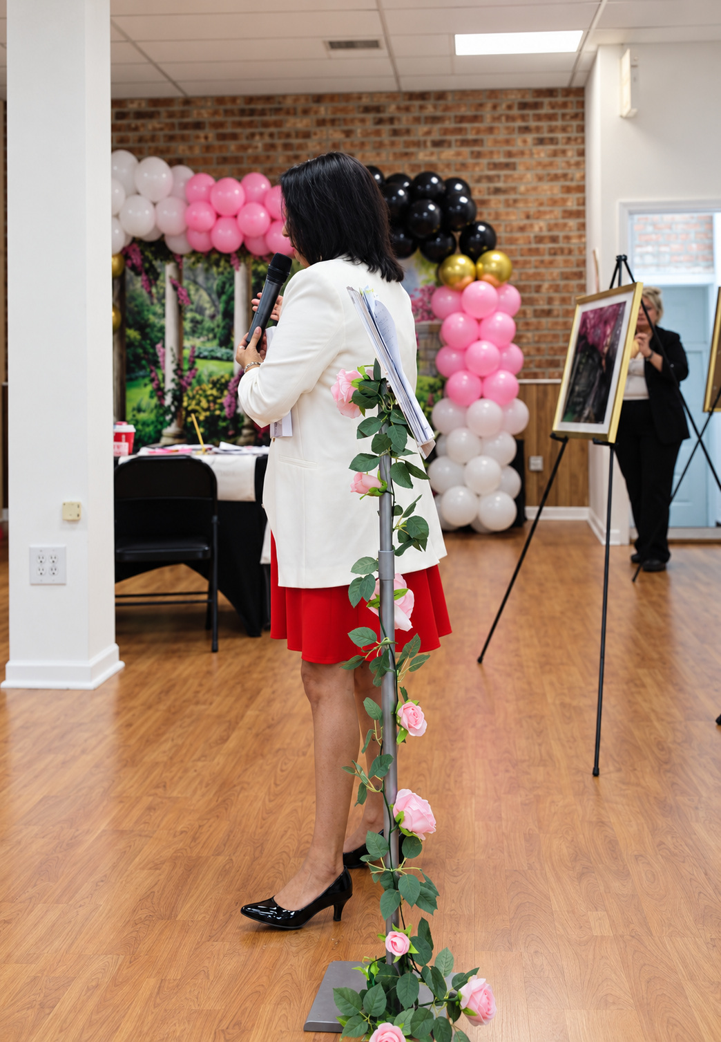 A guest speaking at the Nika's Reign Launch Reception